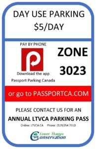 Parking sign located at CM Wilson Conservation Area. Parking is $5 per day, pay by phone using the Passport Parking Canada app or go to passportca.com. Zone 3023